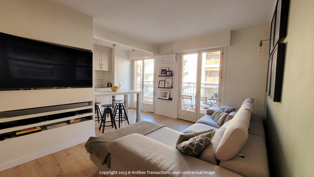 view of the living/dining area and the semi-open kitchen