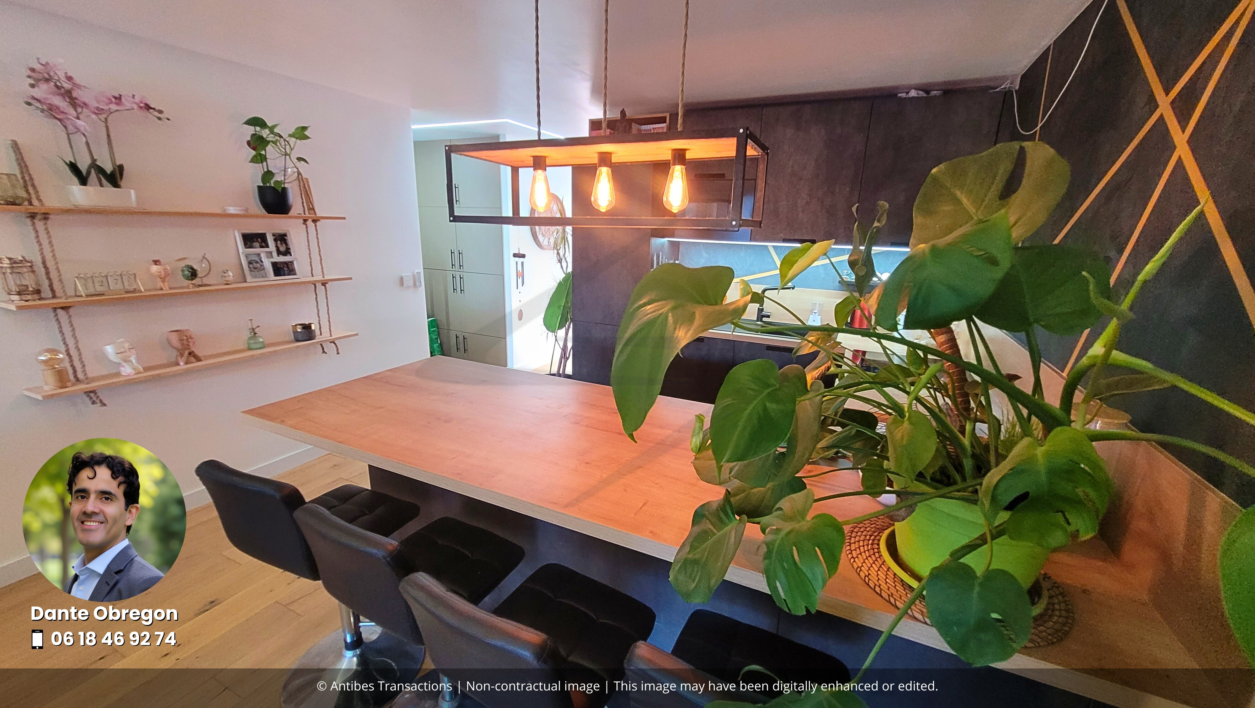 Modern fitted open-plan kitchen with dining area