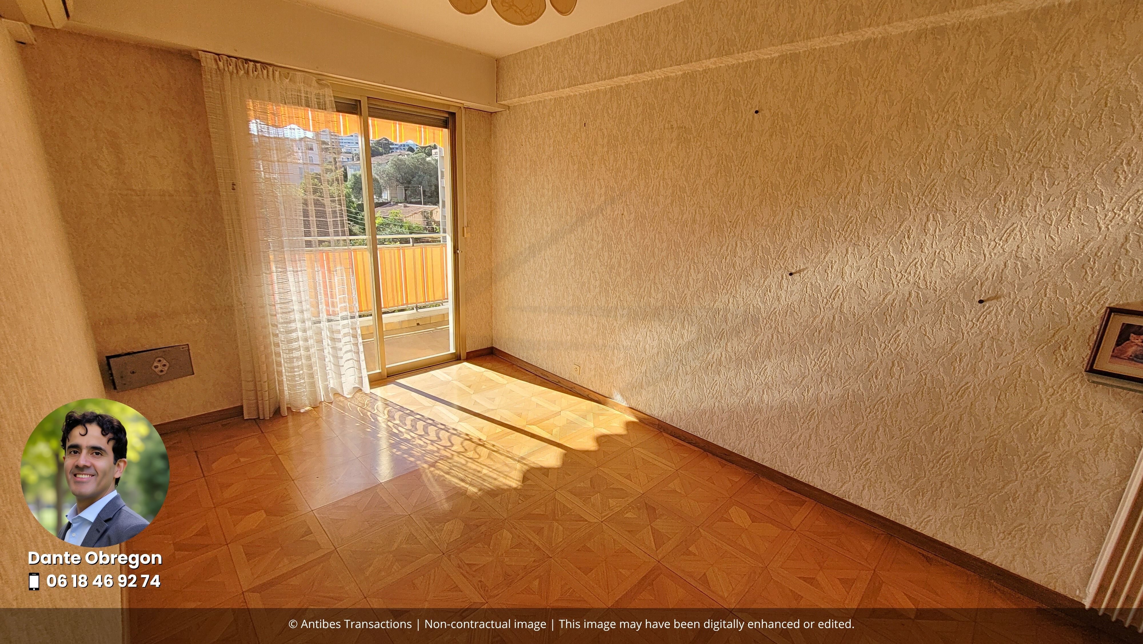 View of one of the three bedrooms