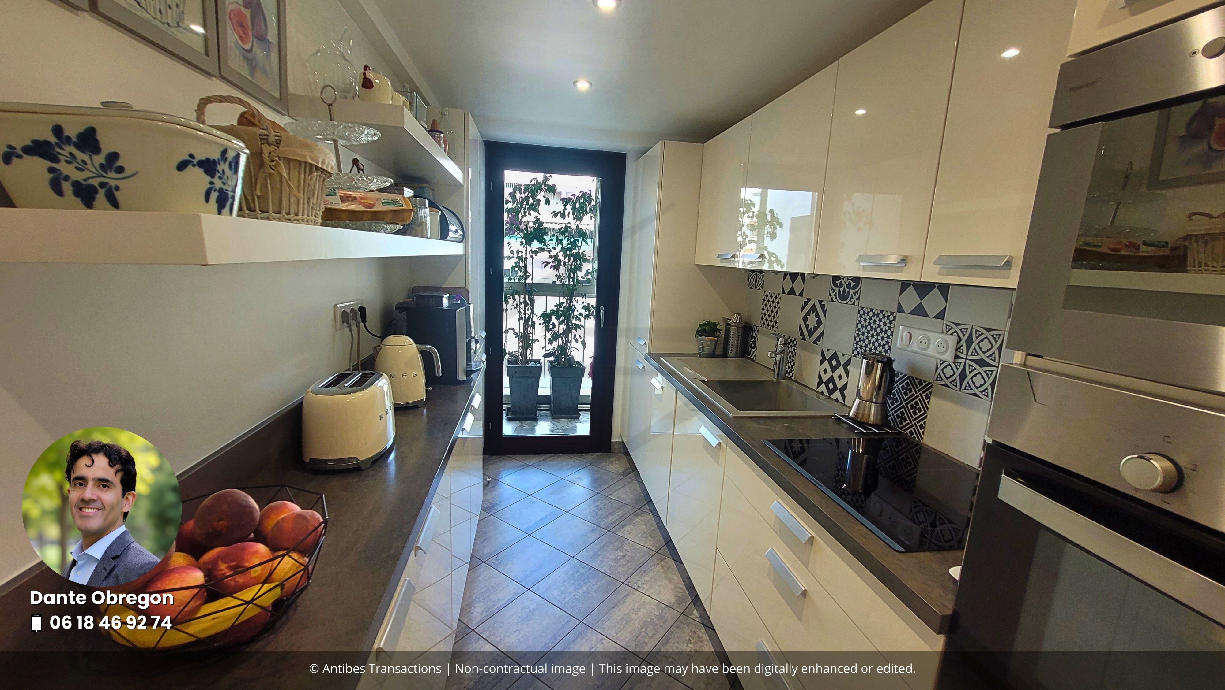 View of the kitchen with access to the glazed loggia