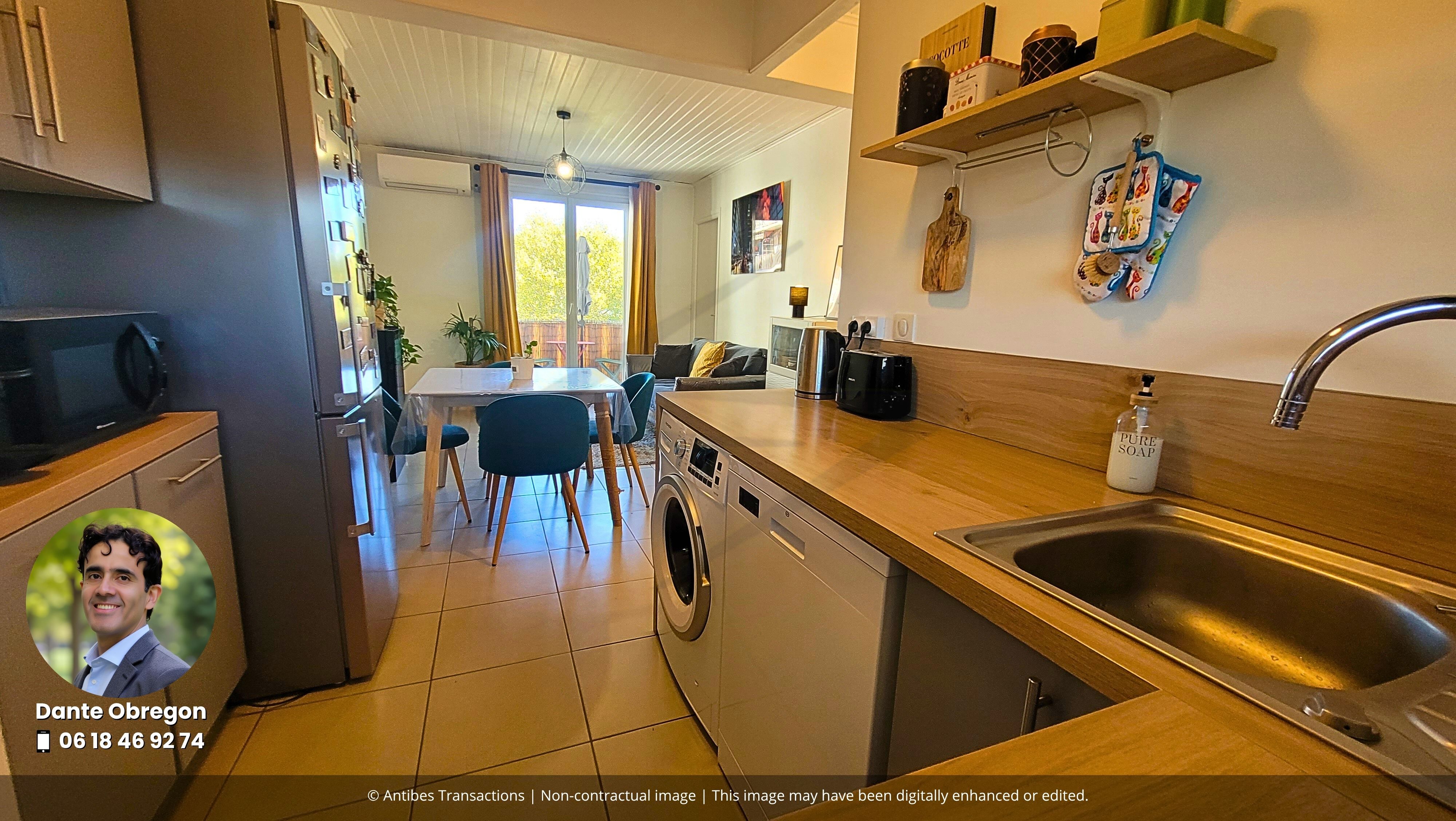 View of the open-plan kitchen and lounge/dining room