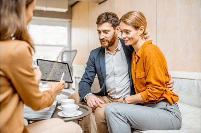 couple with a real estate agent